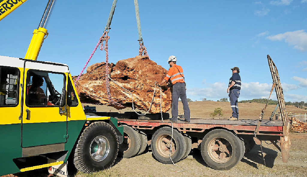 ROCK ON: Wayne Matherson and Chris Schobbe with Jenny and Jim Elliot’s boulder of Australian jade, which is bound for Canberra. ROCK ON: Wayne Matherson and Chris Schobbe with Jenny and Jim Elliot’s boulder of Australian jade, which is bound for Canberra.